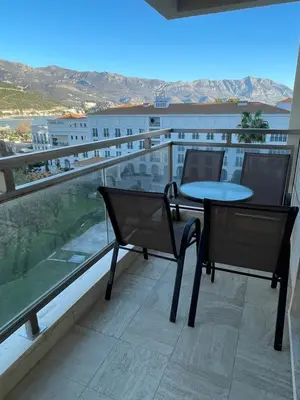 a balcony with a table and chairs and a view at Lux apartment Komel in Budva