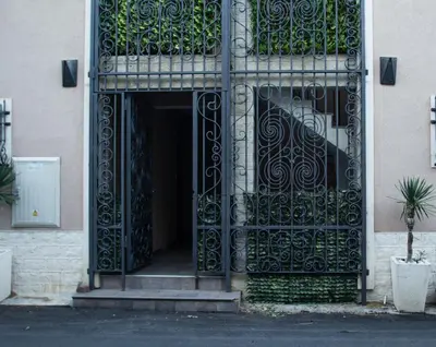 an entrance to a building with an iron gate at Villa Danile Cosy Apartments in Budva