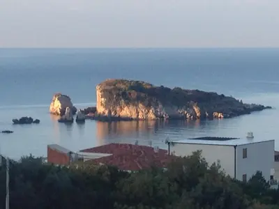 a small island in the middle of the water at Apartments Svetlana in Utjeha