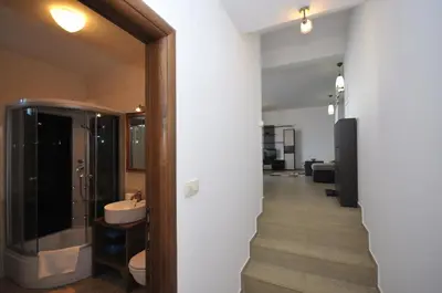a bathroom with a sink and a glass shower at Apartments Spas in Budva