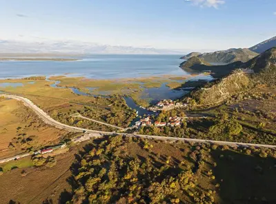 an aerial view of a road next to the water at Ethno House Ivanovic in Virpazar