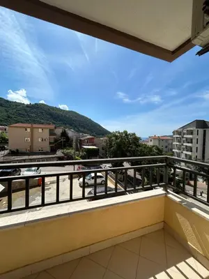 a balcony with a view of a mountain at Apartment Pegaz in Budva