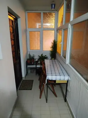a balcony with a bench and a window at Sandra Apartment 3 in Kotor
