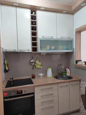 a small kitchen with a sink and a stove at Nice apartment near Old Town and sea in Budva