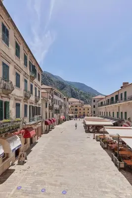 an empty street in an old town with buildings at Spacious 1Bedroom on the Main Square of Kotor in Kotor