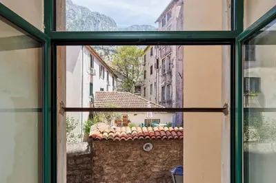a view from an open window of a building at 1-Bedroom Flat on the Main Square in the Old Town in Kotor