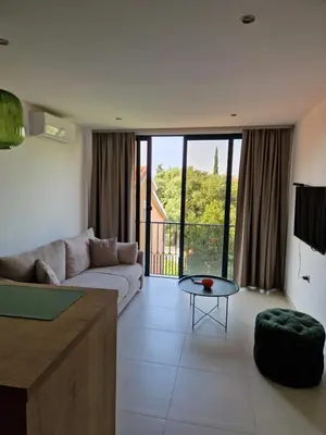 a living room with a couch and a table at Guest House Damjana in Budva
