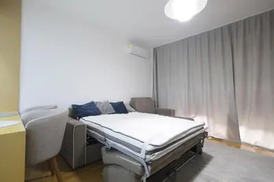 a hospital room with a bed and a window at Status-M Apartments 103 in Becici