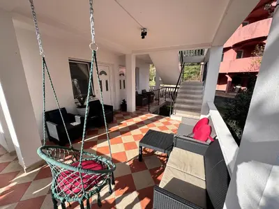 a living room with a porch with swings at Mon in Bar