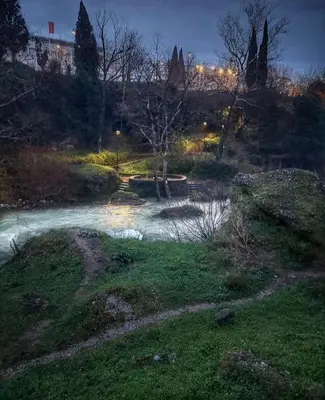 a stream of water in a park at night at Naki home in Pobrežje
