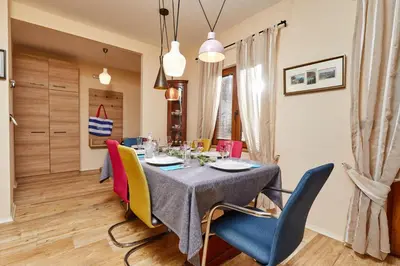 a dining room with a table and chairs at Beachfront Villa Adria - Happy Rentals in Kotor