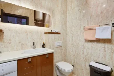 a bathroom with a toilet and a sink and a mirror at Beachfront Villa Adria - Happy Rentals in Kotor