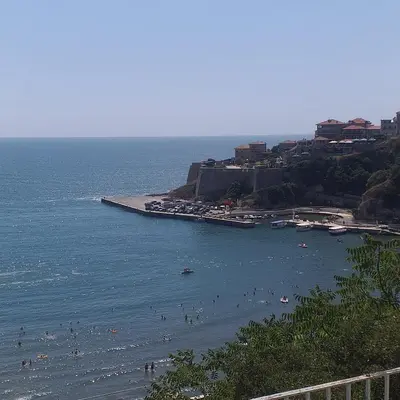 a group of people in the water at a beach at Apartments Marovic in Ulcinj