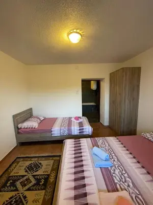 two beds sitting in a room with at Apartments Marovic in Ulcinj