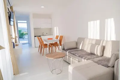 a living room with a couch and a table at Apartments Chiara Garden in Ulcinj