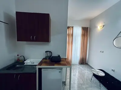 a kitchen with a sink and a counter top at Apartments Duraku in Ulcinj