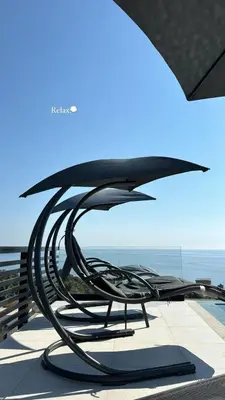 a metal bench sitting on top of a building at Luxury Villa Lorcrimar in Masline