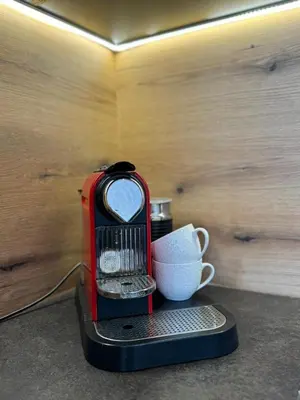a red blender with a cup on a table at Luxury Villa Lorcrimar in Masline