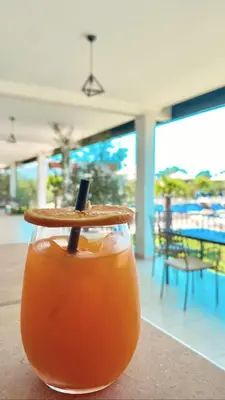 a drink sitting on top of a table at Imperial Family Bungalows in Ulcinj