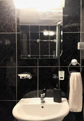 a bathroom with a sink and a mirror at B&L Chic apartment in Škaljari