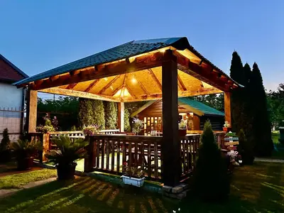 a wooden gazebo in a yard at Tiny house 1 - Imanje Terzic in Podgorica