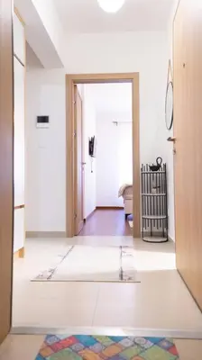 a room with a hallway with a door open at Ana Lux Master apartament in Podgorica