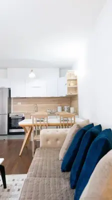 a living room with a couch and a table at Ana Lux Master apartament in Podgorica