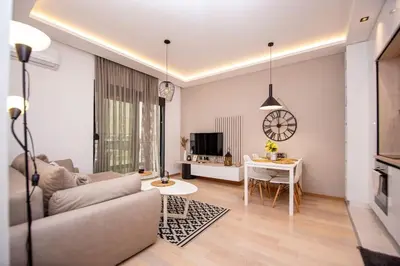 a living room with a couch and a table at Comfort apartment Becici by In Property in Becici