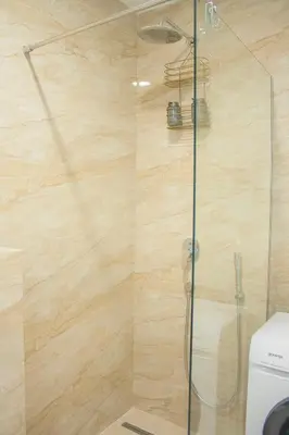 a bathroom with a shower with a glass door at The Dream Getaway SkyLine by DeVasco in Becici