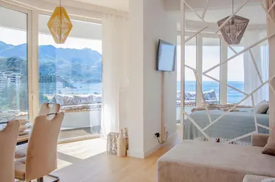 a bedroom with a bed and a large window at The Dream Getaway SkyLine by DeVasco in Becici