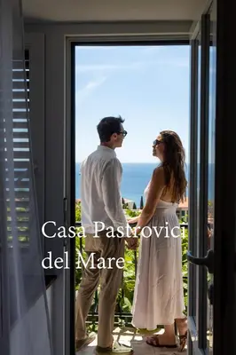 a bride and groom standing in front of a window at Casa Pastrovici del Mare in Petrovac na Moru
