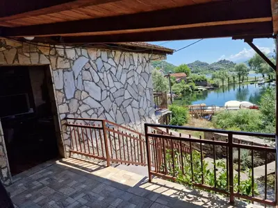 a view of the river from the porch of a house at Lakeside oasis home Karuc in Karuč