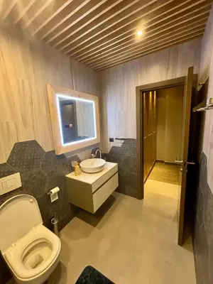 a bathroom with a toilet and a sink at smgold lux apartman in Podgorica