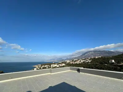 a view of the ocean from a balcony at sunsetmontenegro in Utjeha
