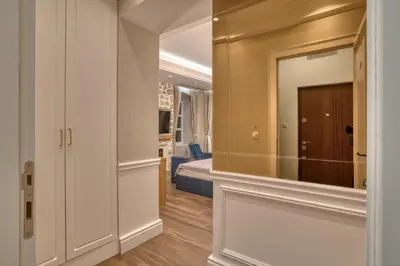 a hallway with a mirror and a bedroom at Hive Luxury Suites by MN Property in Kotor