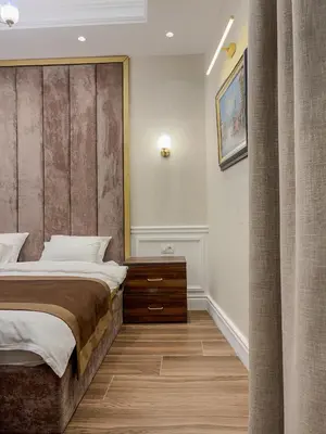 a bedroom with a large bed and a curtain at Hive Luxury Suites by MN Property in Kotor