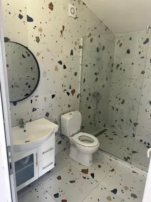 a bathroom with a toilet and a sink at La Terrazza in Dobra Voda