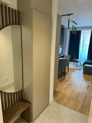 a living room with a couch and a table at Cozy sea view apt with garage in Budva