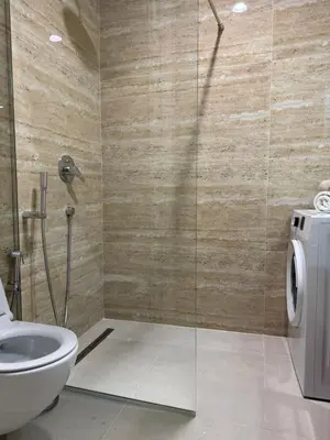 a bathroom with a shower and a toilet at Cozy sea view apt with garage in Budva