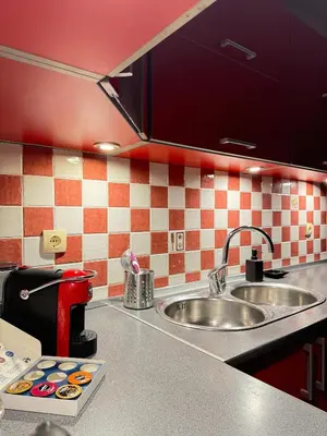 a kitchen with a sink and a counter top at Anchor 23 in Kotor