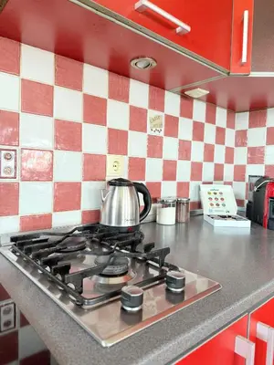 a tea kettle sitting on top of a stove in a kitchen at Anchor 23 in Kotor