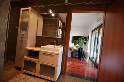 a bathroom with a sink and a mirror at Andrej home in Golubovci