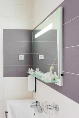 a bathroom with a sink and a mirror at Tophill Altezza 9 best view and pool in Budva