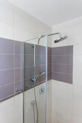 a shower with a glass door in a bathroom at Tophill Altezza 9 best view and pool in Budva