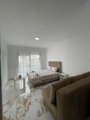 a living room with a bed and a couch at Summer Dreams in Bar