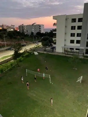 a group of people playing soccer in a field at Summer Dreams in Bar