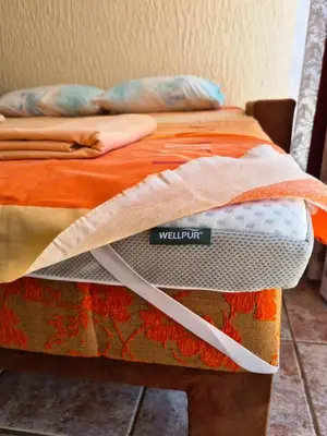 a bed with a sign that says wellopt on it at Smokva in Bar