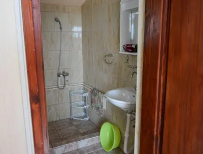 a bathroom with a shower and a sink at Smokva in Bar