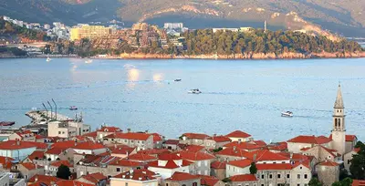 a town with red roofs and a large body of water at Status-M Apartments Franca sea view in Budva