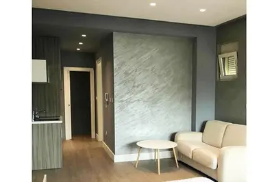 a living room with a couch and a table at Status-M Apartments Franca sea view in Budva